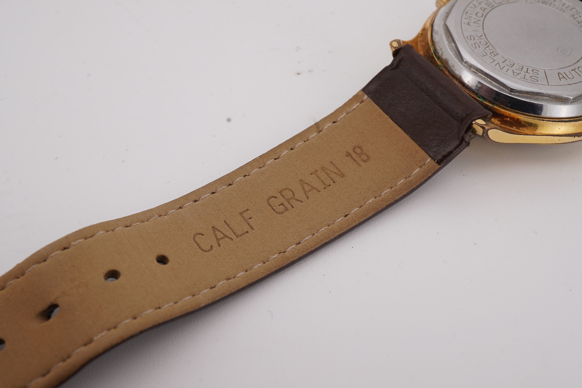 A gentleman's steel and gold plated Montfort Superautomatic wrist watch, with Roman and quarterly Arabic numerals, case diameter 34mm, on a later associated leather strap.
